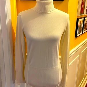 Ivory turtleneck sweater zipper sleeves. Never worn
